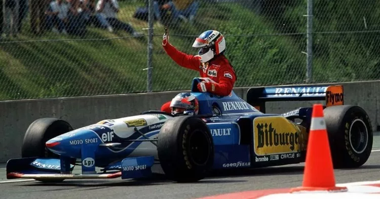 11 Giugno 1995: Jean Alesi viene condotto ai box da Michael Schumacher dopo la vittoria del Gp del Canada